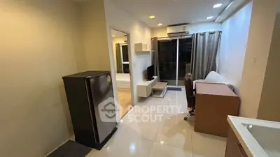 Modern living room with sleek furniture and balcony access