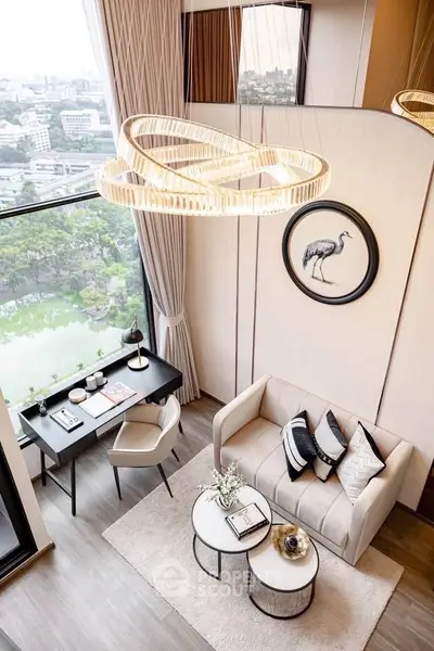 Luxurious high-rise living room with stunning city view, elegant decor, and modern chandelier.