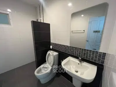 Modern bathroom with sleek design and contemporary fixtures.