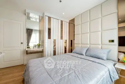 Luxurious modern bedroom with stylish decor and ample natural light