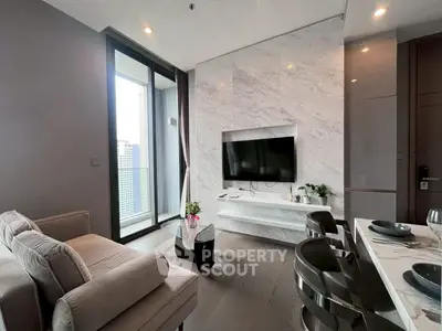 Modern living room with marble wall and balcony view in luxury apartment