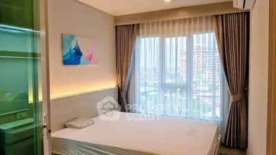 Modern bedroom with large window and city view, featuring elegant curtains and stylish decor.
