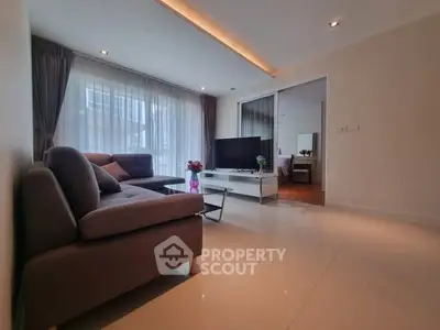 Spacious modern living room with large windows and stylish furniture