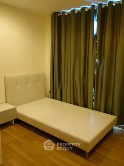 Cozy bedroom with minimalist design and elegant curtains