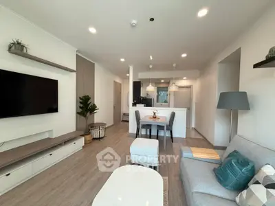 Modern open-plan living room with stylish decor and natural light