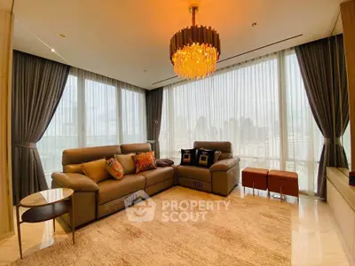 Luxurious living room with panoramic city views and elegant chandelier