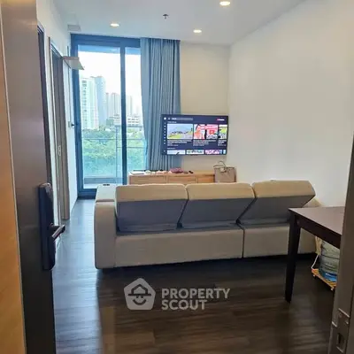 Modern living room with city view and cozy sofa setup