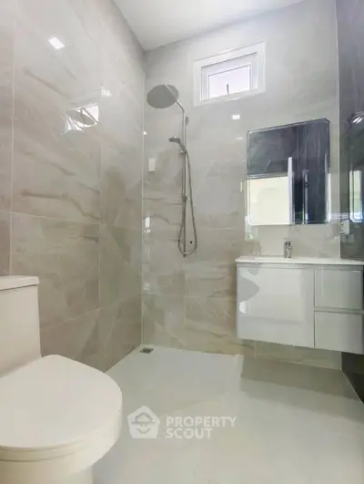 Modern bathroom with sleek shower and elegant fixtures
