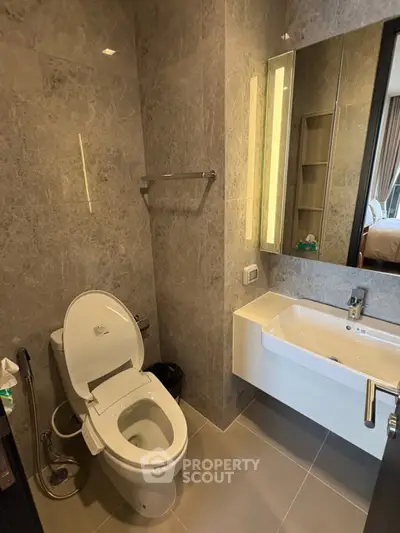 Modern bathroom with sleek fixtures and elegant stone tile design