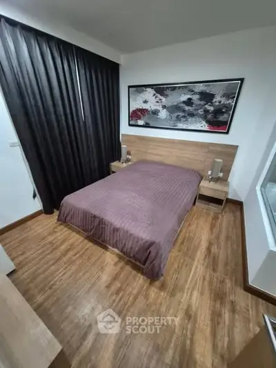 Modern bedroom with stylish decor and wooden flooring