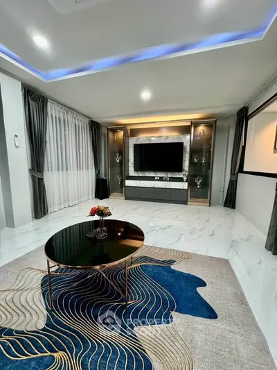 Luxurious modern living room with elegant decor and ambient lighting