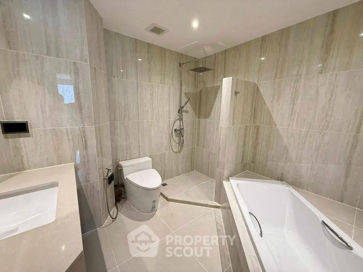 Luxurious modern bathroom with elegant fixtures and spacious bathtub