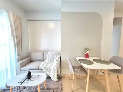 Modern living room with cozy seating and stylish dining area, perfect for urban living.