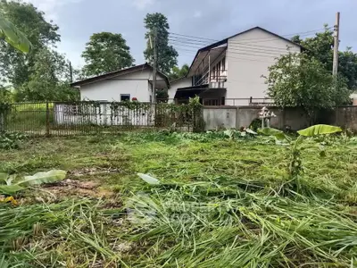 Spacious residential property with lush greenery and a charming house, perfect for development or investment.