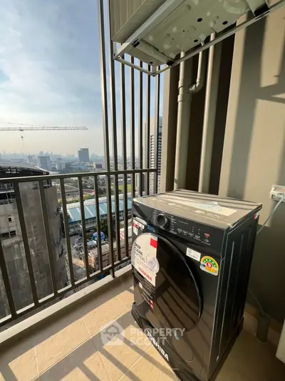 High-rise balcony with city view and modern washing machine