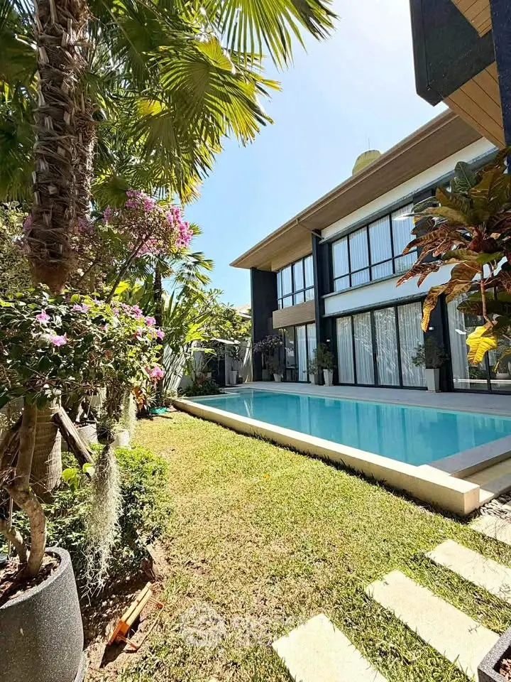 Luxurious modern villa with private pool and lush garden, perfect for serene living.