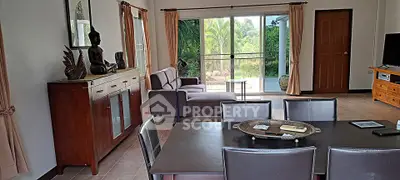 Spacious living room with elegant decor and garden view