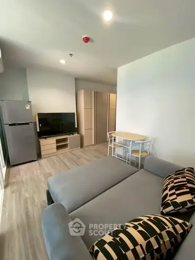 Modern living room with sleek furniture and open layout in a stylish apartment.