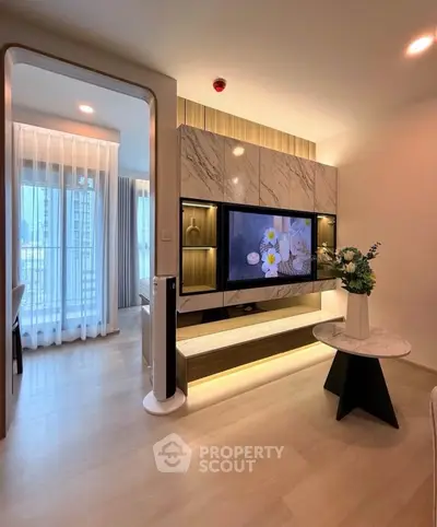 Modern living room with stylish TV unit and elegant decor in a contemporary apartment.