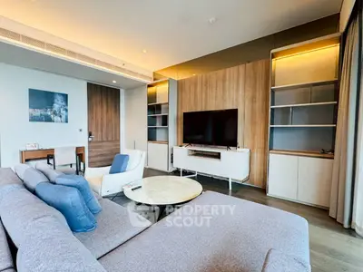 Luxurious modern living room with stylish furniture and large TV setup