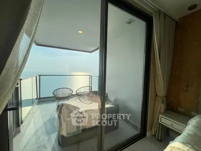 Luxurious balcony with stunning ocean view and modern furniture