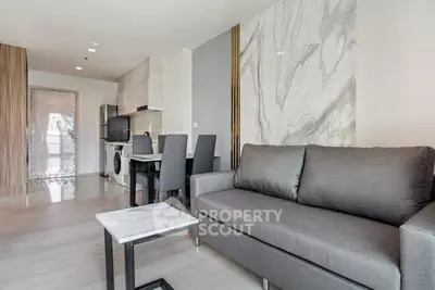 Modern living room with sleek furniture and marble accents