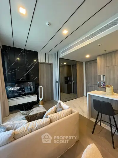 Modern living room with sleek design, open kitchen layout, and stylish furniture in a contemporary apartment.