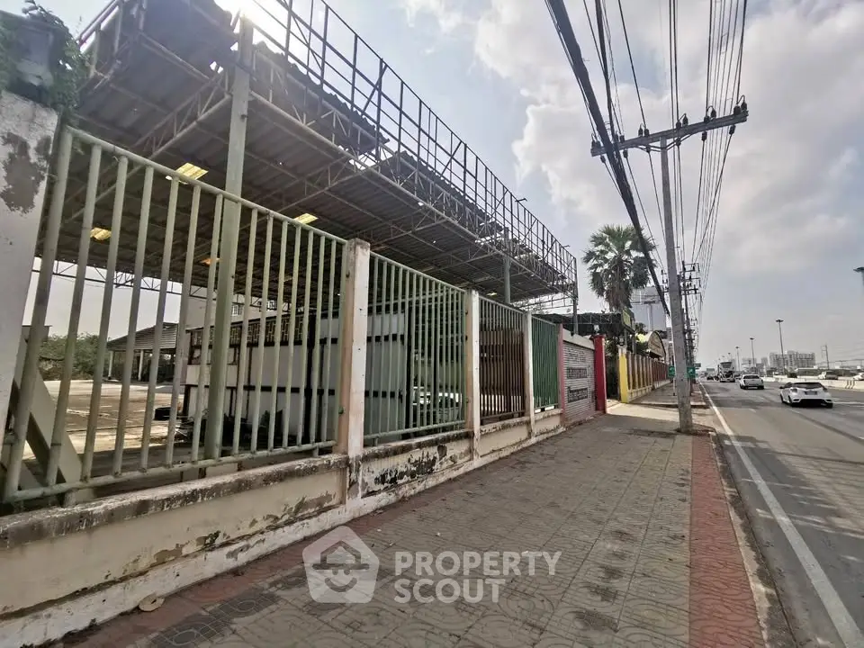 Industrial property exterior with metal structure and street view