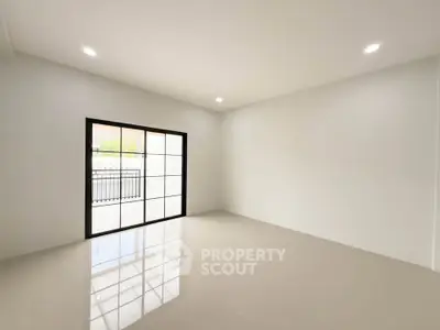 Spacious empty room with large windows and glossy tiled floor, perfect for customization.