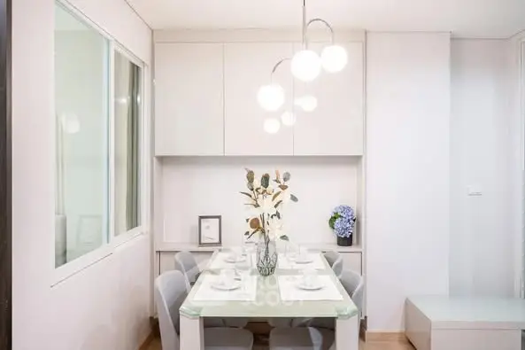 Modern dining area with elegant lighting and minimalist decor