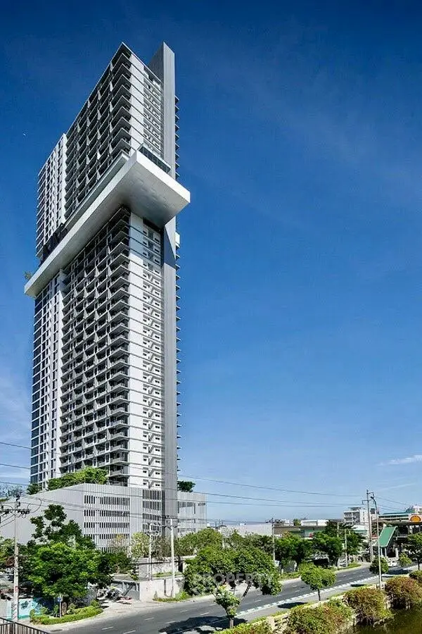 Stunning modern high-rise building with unique architectural design and panoramic city views.