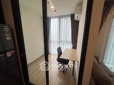 Modern study room with desk and chair, featuring large window and air conditioning.