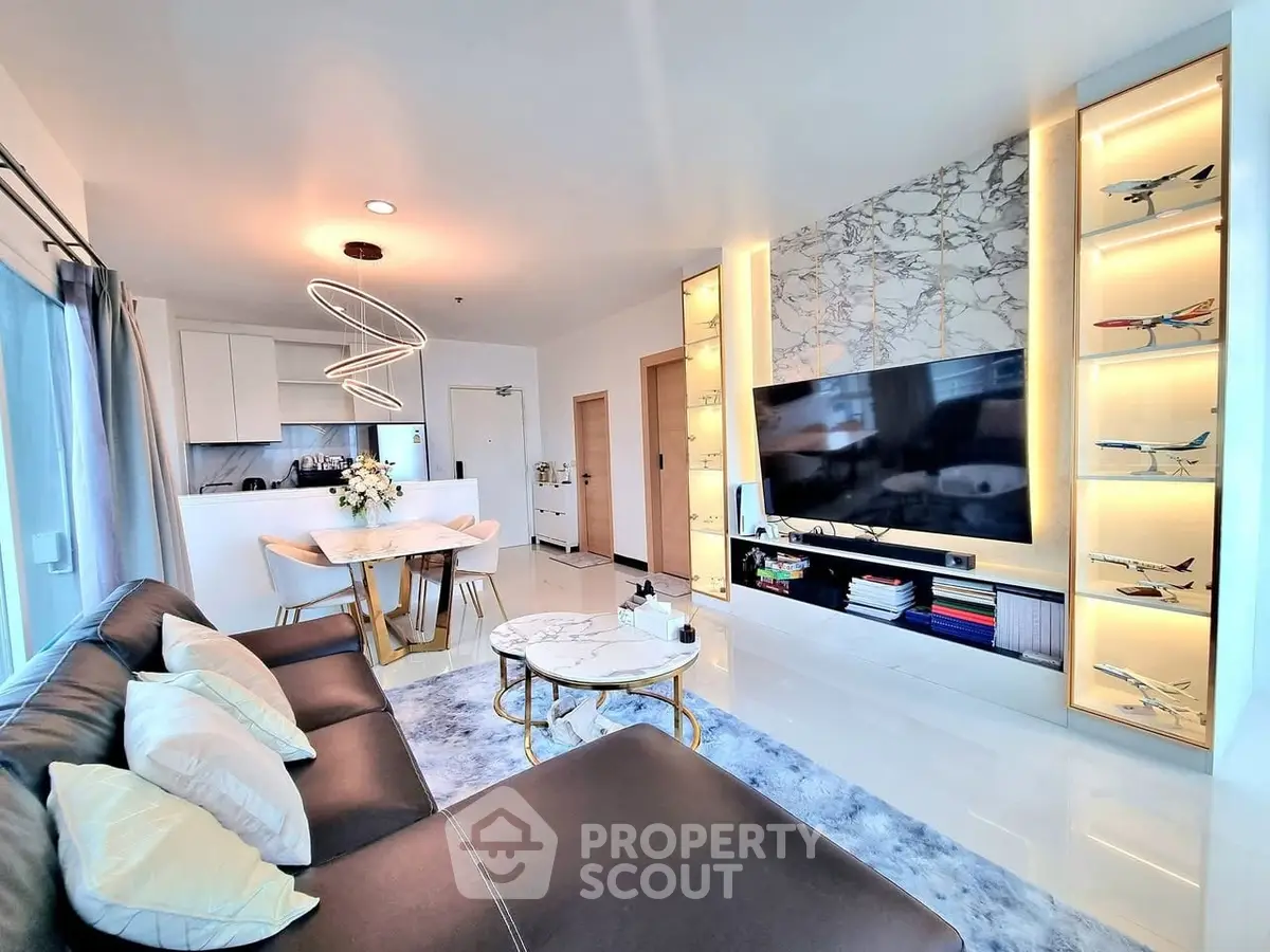 Luxurious modern living room with elegant decor and open kitchen layout