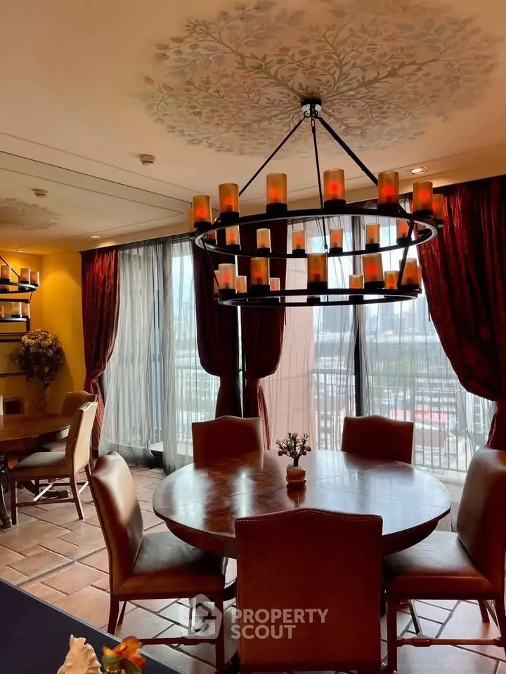 Elegant dining room with chandelier and large windows in luxury home
