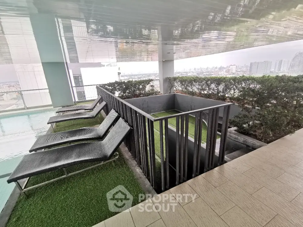Luxurious rooftop pool area with stunning city views and modern lounge chairs