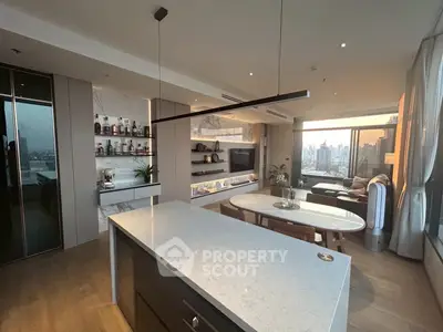 Luxurious open-plan living room with modern kitchen and stunning city view