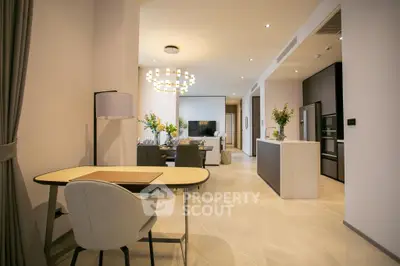 Luxurious open-plan living room with modern dining area and stylish decor