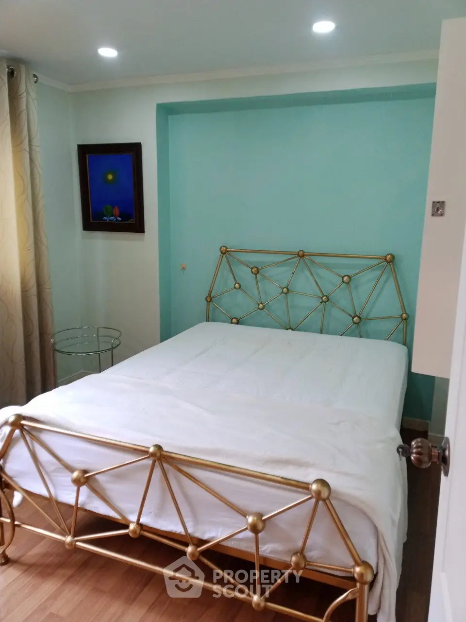 Charming bedroom with elegant metal bed frame and cozy decor