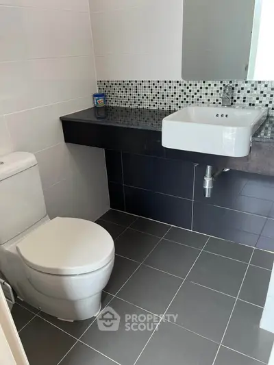 Modern bathroom with sleek design and stylish tile accents