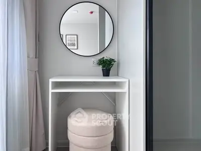 Modern minimalist study nook with round mirror and plush stool
