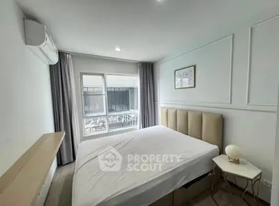 Modern bedroom with large window and minimalist decor