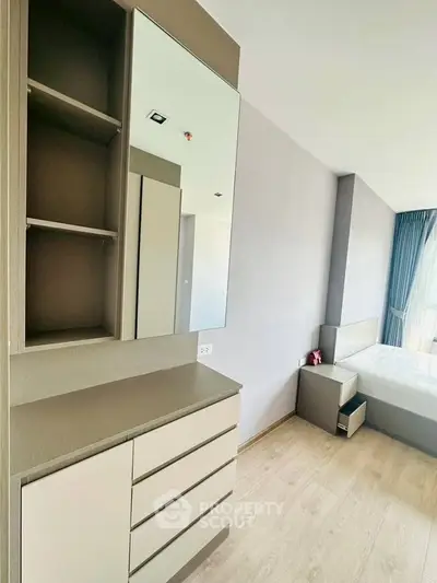 Modern bedroom with sleek furniture and natural light