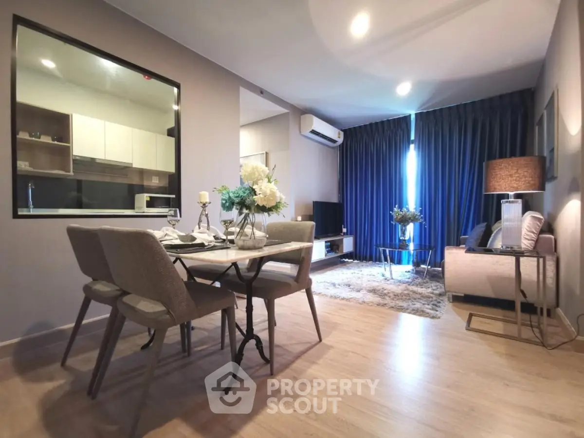 Modern living room with dining area and open kitchen in stylish apartment