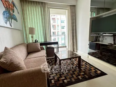 Stylish modern living room with large TV and balcony view in urban apartment.