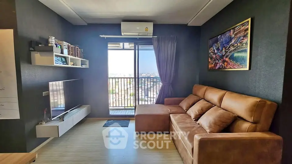 Modern living room with leather sofa and city view balcony