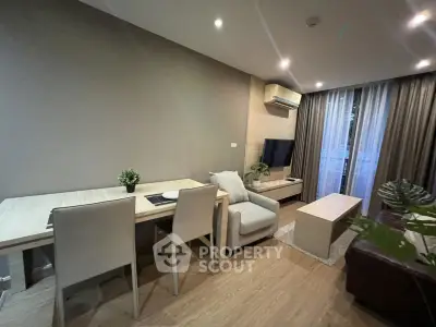 Modern living room with stylish furniture and natural light, perfect for relaxation and entertainment.