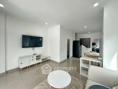 Modern living room with sleek furniture and open layout