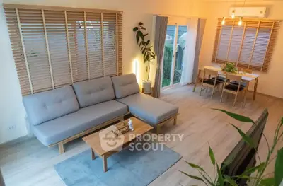 Modern living room with stylish furniture and natural light