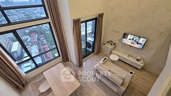 Stunning high-rise living room with panoramic city views and modern decor