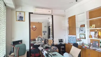 Spacious home office with modern decor and ample natural light